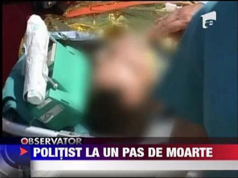 UPDATE: Politist la un pas de moarte