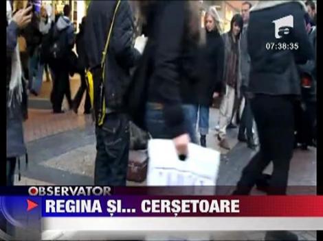 Manechin cu chipul reginei Elisabeta a II-a imbracat in zdrente la cersit