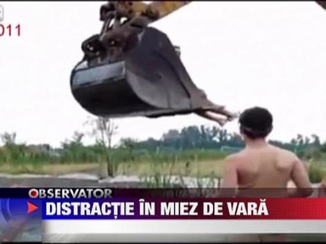 Rusia: La scaldat cu excavatorul