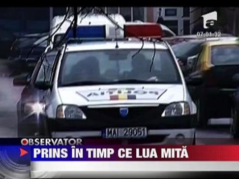 Politist cumparat cu 200 de lei