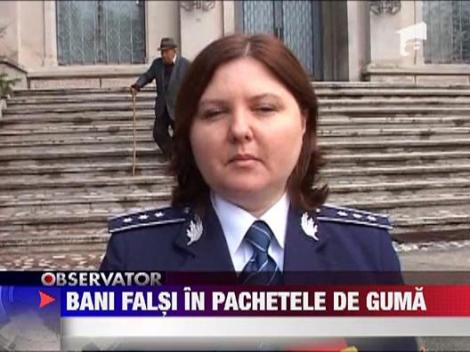 Bani falsi in pachetele de guma