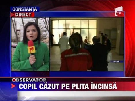 Copil cazut pe plita sobei incinse