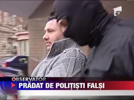 Pradat de politisti falsi