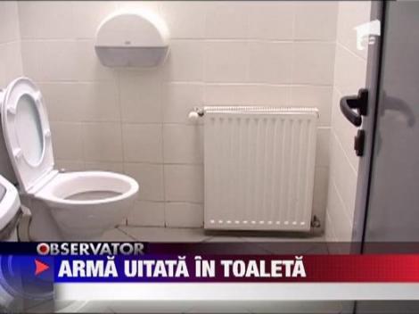Pistol uitat in toaleta