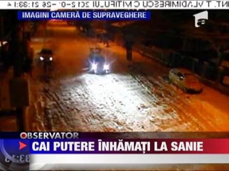 Cu sania legata de masina