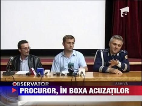Procuror, in boxa acuzatilor