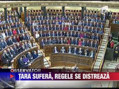 Spania sufera, regele se distreaza