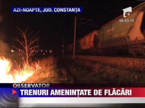 Trenuri amenintate de flacari