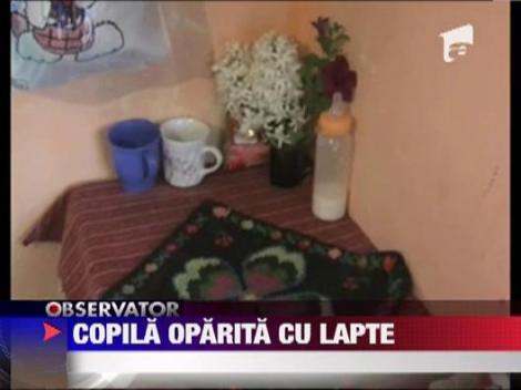 O fetita de 2 ani a fost oparita cu lapte