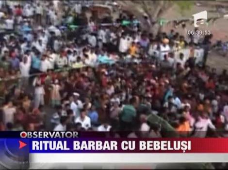 IMAGINI SOCANTE! Ritual barbar cu bebelusi