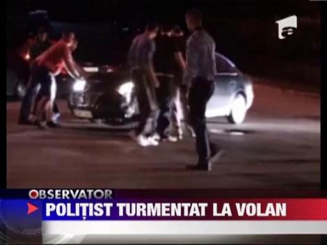Politist turmentat la volan