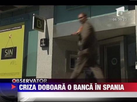 Criza doboara o banca in Spania