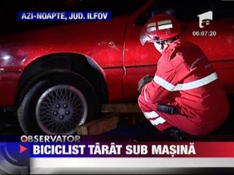 Biciclist tarat sub rotile unei masini