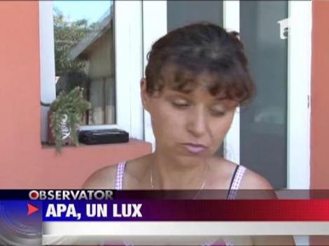 Locuitorii din Stoenesti, judetul Prahova, primesc apa cu "portia"