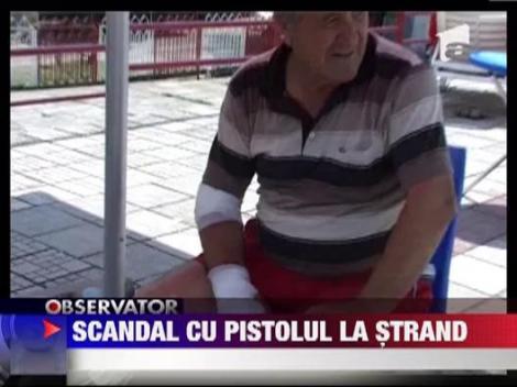 Scandal cu pistolul la strand
