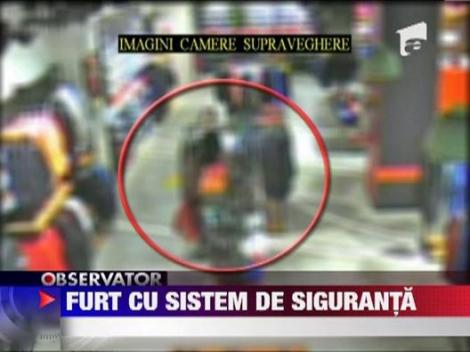 Furt cu sistem de siguranta