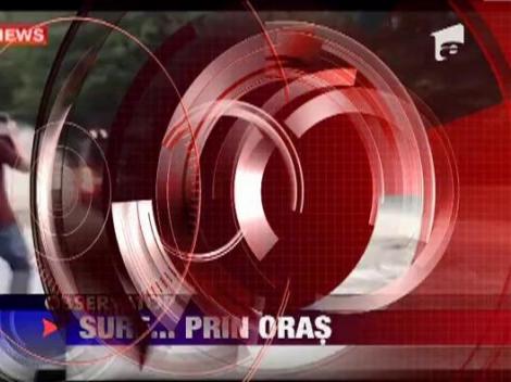 Surf pe strazile unui oras inundat