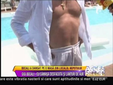 Show Gigi Becali intr-un club din Mamaia: s-a imbatat si a dansat pe mese
