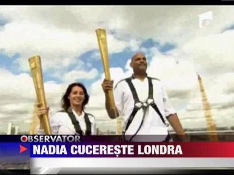 Nadia Comaneci a purtat flacara olimpica