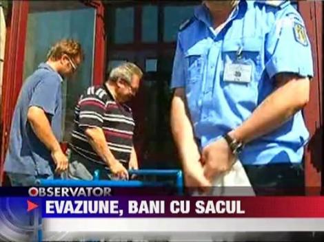 Dosarul evaziunii de 40 mil. €/an: Saci cu bani, in casele clanului "Butoane"