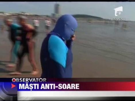 O noua moda? Asiaticele se expun la soare cu o cagula pe cap!