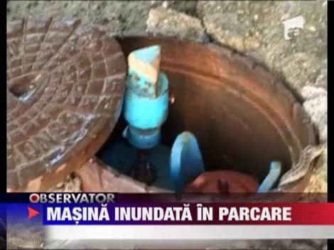 Masina inundata in parcare