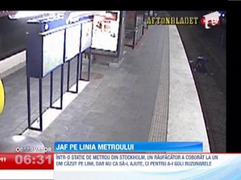 Un hot isi buzunareste victima, pe care o abandoneaza pe sinele de tren