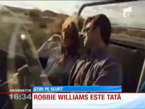 Asa arata "taticul" si Robbie Williams si "puiul" Theodora