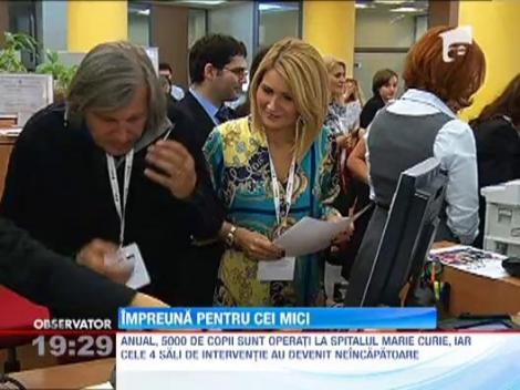 Nadia, Ilie Nastase si Hagi, functionari de banca pentru o cauza nobila