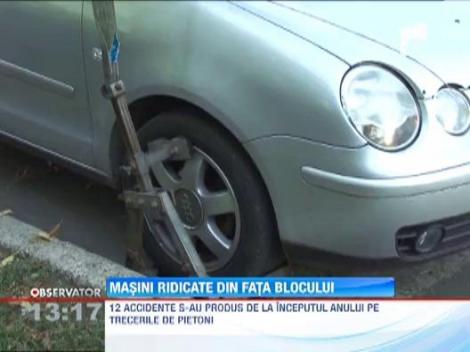Masini ridicate din fata blocului la Ploiesti