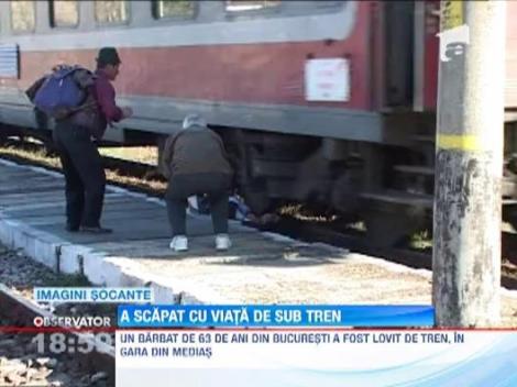IMAGINI SOCANTE! Un barbat din Medias a scapat cu viata desi a fost calcat de tren