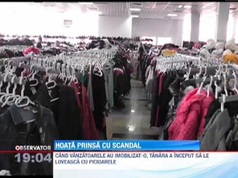 UPDATE / O tanara a fost surprinsa in timp ce fura haine dintr-un magazin