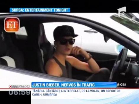 Justin Bieber s-a certat cu un ziarist de la volanul masinii sale Ferrari
