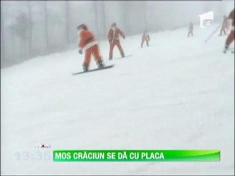 Mos Craciun se da cu placa de snowboard si schiaza ca un campion olimpic!