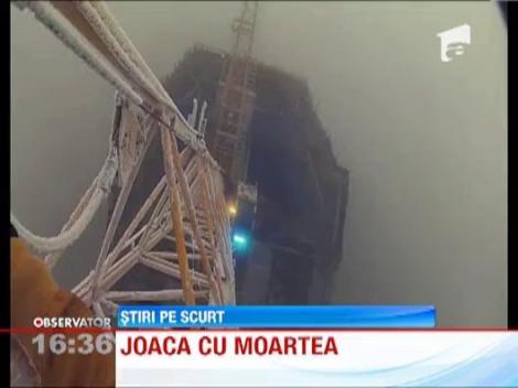 Rusia: Mai multi tineri au escaladat cea mai inalta cladire din Europa! Fara hamuri de siguranta!