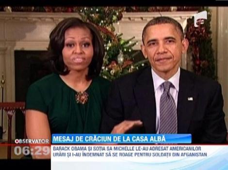 Presedintele Barack Obama si sotia sa Michelle le-au urat americanilor un Craciun fericit