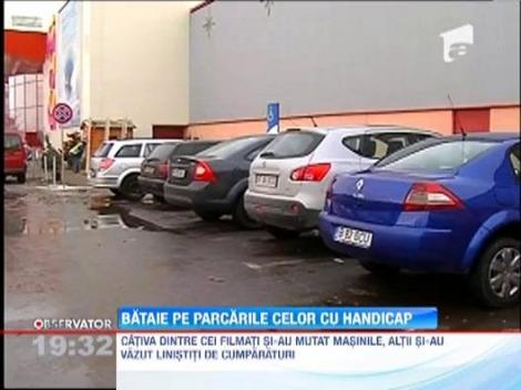 Bataie pe parcarile celor cu handicap