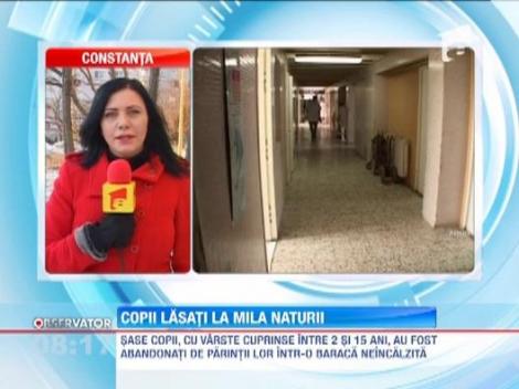 Sase copii, abandonati de parinti intr-o baraca neincalzita