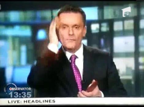 Un prezentator de stiri al unei televiziuni irlandeze si-a pudrat nasul in direct si si-a aranjat tinuta