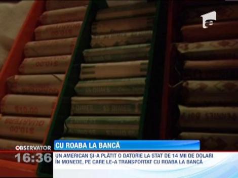 Un american si-a platit o datorie la stat de 14 mii de dolari in monede, pe care le-a transportat cu roaba
