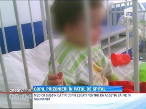 Copii tinuti legati de paturi in sectia de Pediatrie a spitalului din Buzau