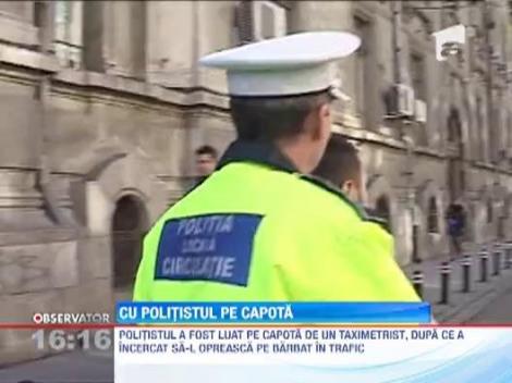 Un politist din Craiova a fost luat pe capota de un taximetrist