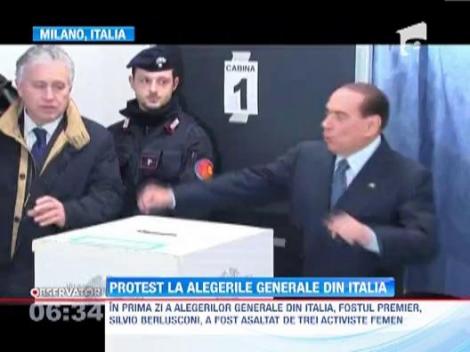 VIDEO! Berlusconi, contestat de activiste FEMEN. Peste 47 de milioane de italieni sunt asteptati la urne