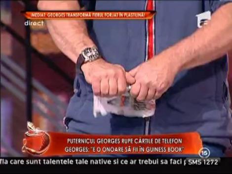 Georges Christen rupe o carte de telefoane cu mainile goale
