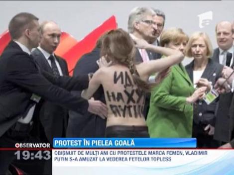 Angela Merkel si Vladimir Putin, intampinati de activistele FEMEN