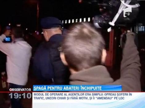 Politisti rutieri retinuti! Luau spaga in functie de marca masinii