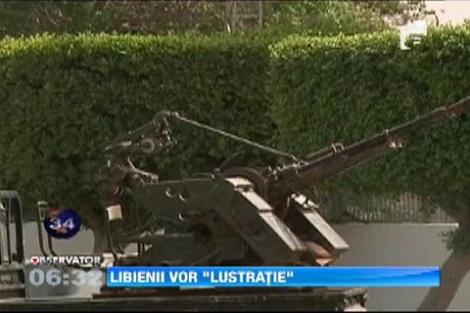 Mai multi oameni inarmati au ocupat ministerul de interne si sediul televiziunii publice din Libia