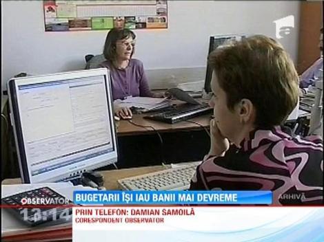 Bugetarii isi iau banii mai devreme