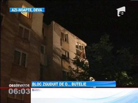 Bloc zguduit de o butelie