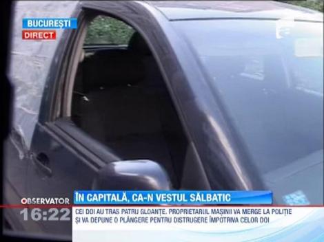 Surprinsi de camerele de supraveghere in timp ce trageau cu o arma intr-o masina